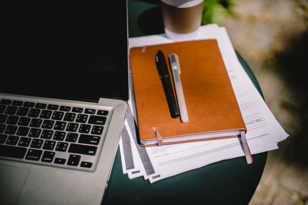 Photo of a laptop and study notebook for Jasper Shin's Aspireship Success Story about landing a new SaaS sales job in less than a month of signing up for the SaaS Sales Foundations on-demand, online sales training course.