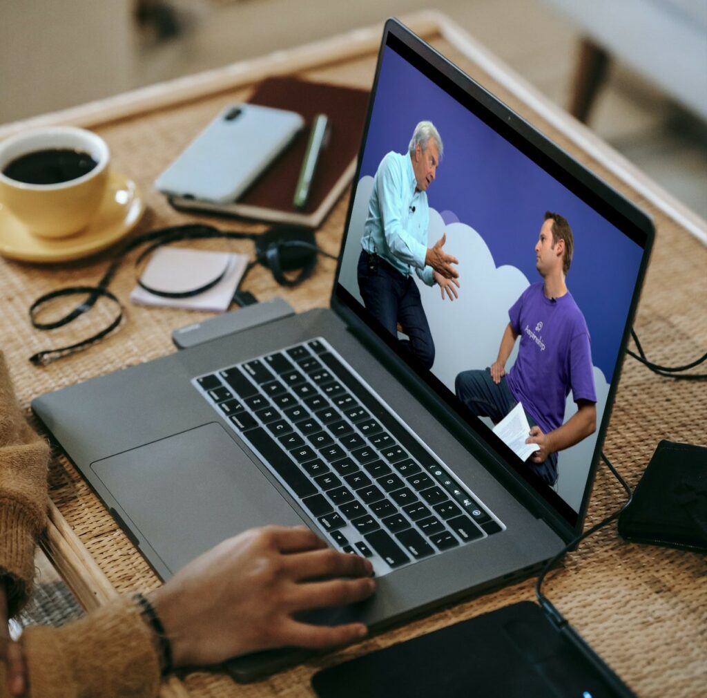 Photo of a job seeker student watching a SaaS Sales Foundations video of Skip Miller and Corey Kossack; Aspireship provides free SaaS sales job training and hiring opportunities. 