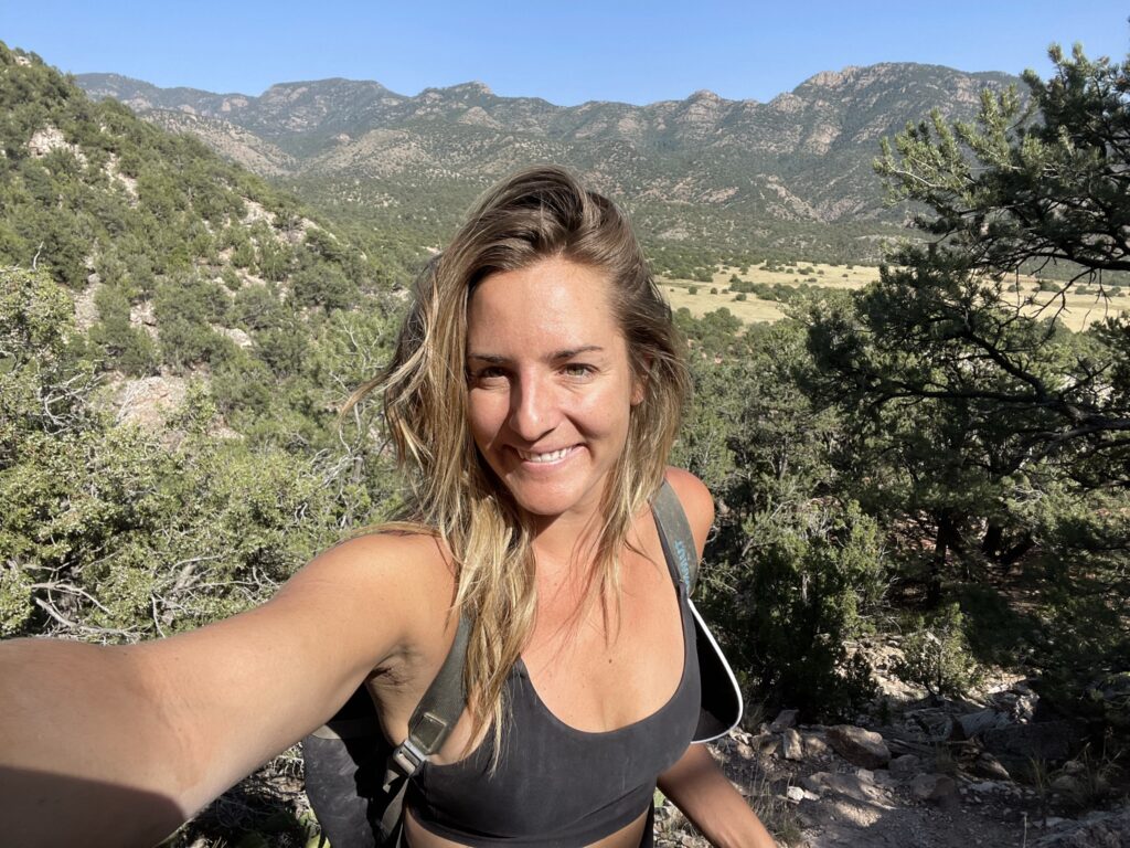 Photo of Aspireship grad Hillary Farmer hiking; Hillary was able to land a new role as an Account Executive at a SaaS company with the help of Aspireship's SaaS sales training course and job placement program.